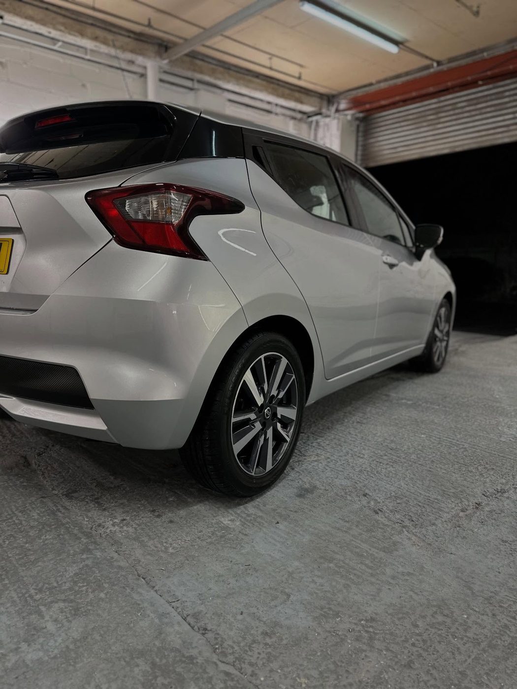 Nissan Micra rear quarter panel after dent repair, restored to a smooth factory finish