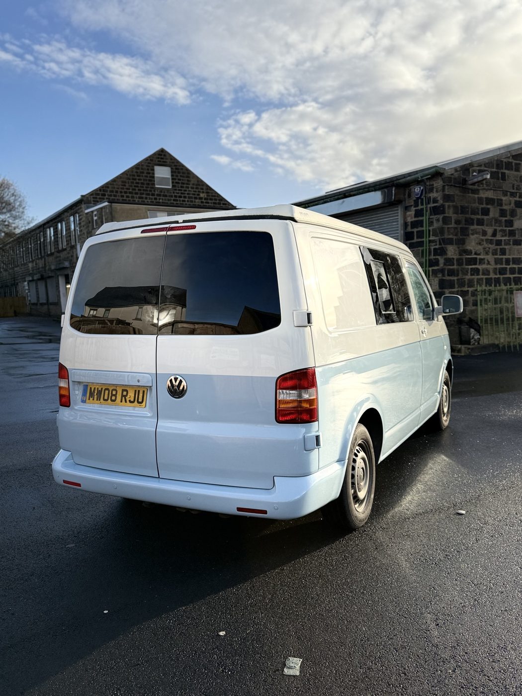 Two-tone VW Transporter, finished paintwork, rear three-quarter view